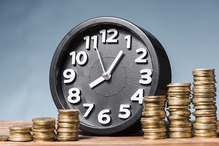 round-alarm-clock-with-stack-increasing-coins-against-blue-background-8